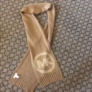 Michael Kors tan scarf with gold logo.